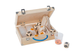 Open box with contents of CultuRallye game, including large wooden dice, orange chips and clear cups